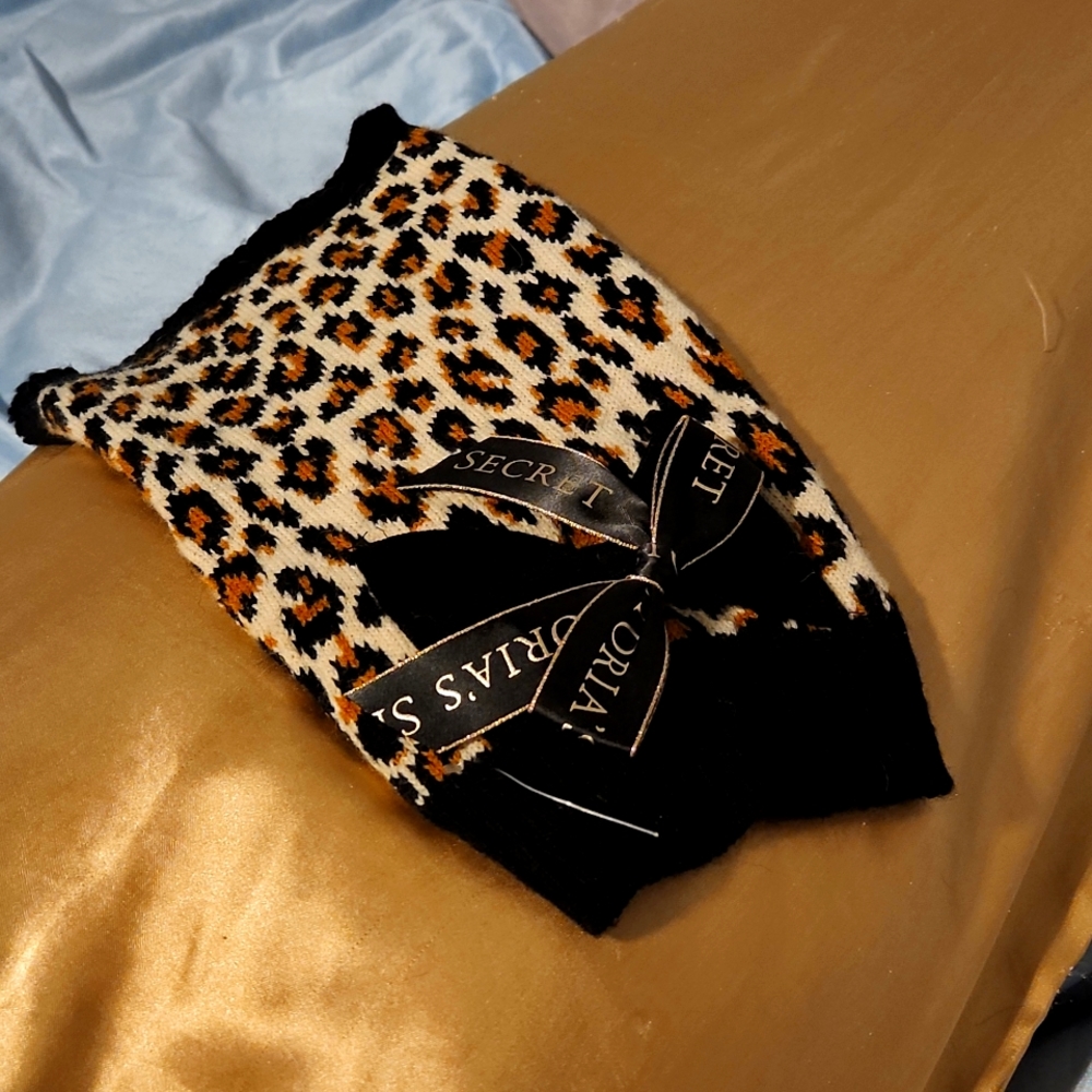 Victoria's Secret small dog sweater. Leopard with black trim.